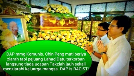 DAP MP for Jelutong Jeff Ooi  seen offering prayers at the casket holding Chin "Butcher of Malaya" Peng's reamins in Bangkok 